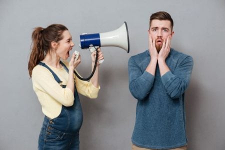 Pregnant woman shouting at her husband