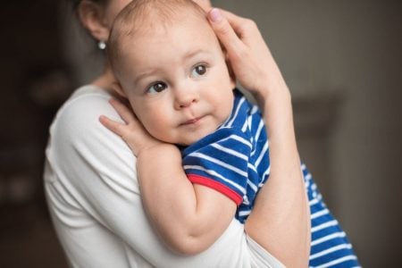 Baby carried on mom's shoulder