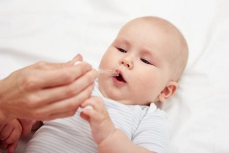 baby given medicine drops