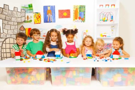 Children playing with building toys