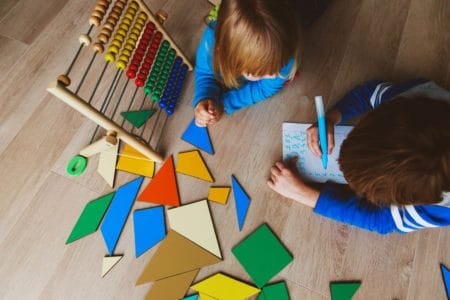 Five year olds playing with educational toys