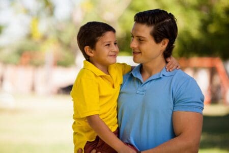 Father and his little son spending time in the park