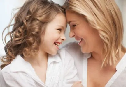 Smiling mother affirming daughter