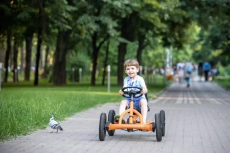 Young boy riding a go kart