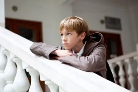 Handsome young boy in the stairs outdoors