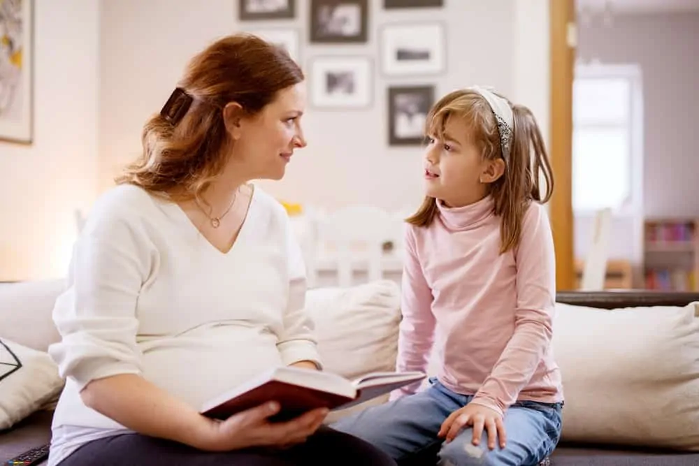 Mother reading to her daughter